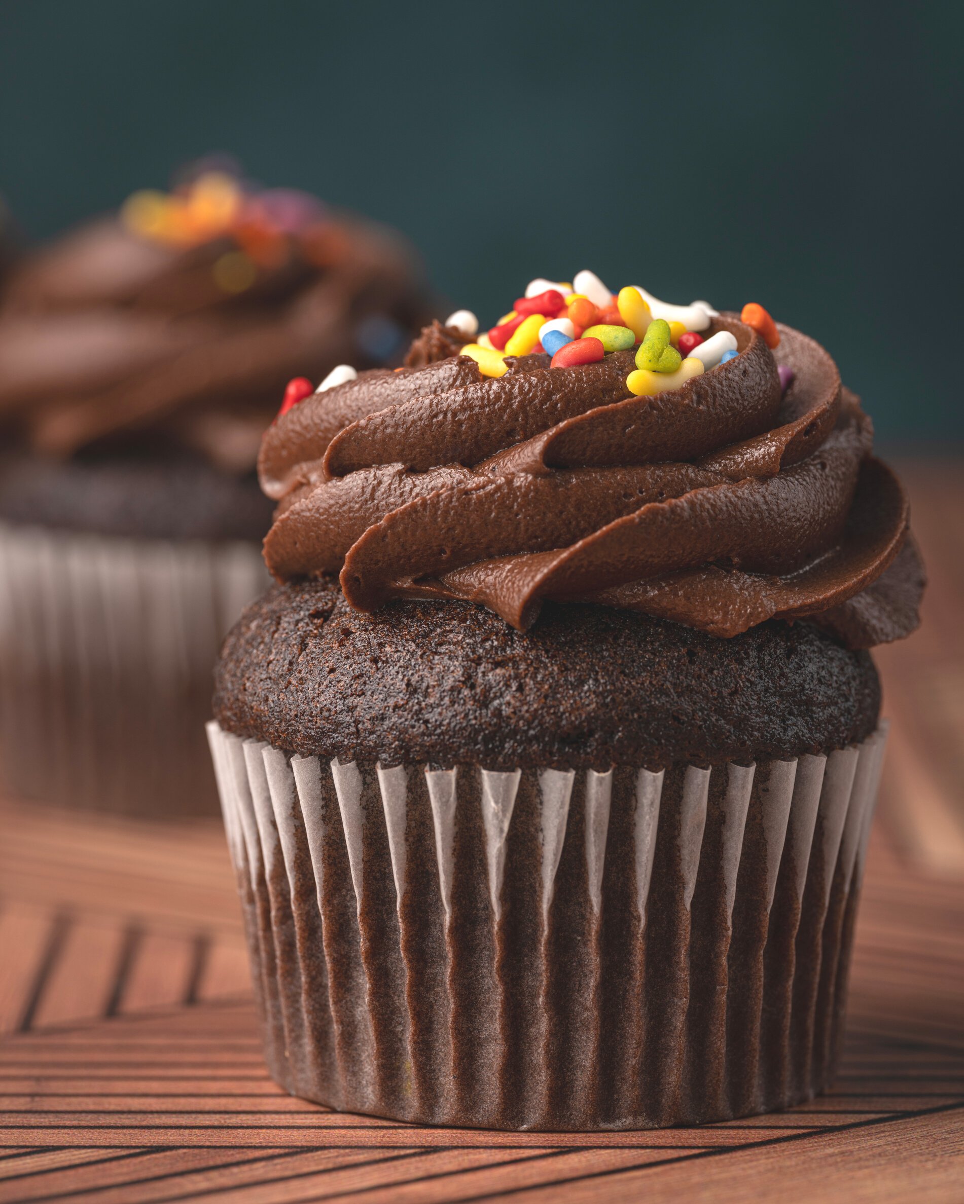 Chocolate Cupcake With Sprinkles on Brown Wooden Table